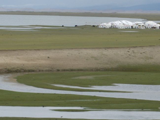  2006:09:03 22:54:49   View of Tibetian tents and Meandering Channel in wetlands from Beach Ridge Outcrop - East Side of Lake.jpg